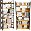 Two identical bookshelves are shown side-by-side against a white background, displaying various items on their shelves. Produktbild-Vorschau