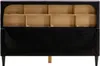 The back of a bed frame is shown, revealing the internal wooden structure and black fabric backing. Voir les images du produit