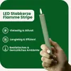 A hand holding a green LED candle with a flame. Produktbild-Vorschau