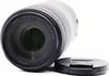 A Canon RF 100-400mm F5.6-8 IS USM telephoto lens is shown on a white background, with its lens cap placed next to it. Náhľad obrázku produktu