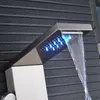 A close-up of a modern shower fixture with LED lights and a waterfall spout. Náhled obrázku produktu