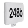 A white LED house number light with black numbers '248b' and a motion sensor on the bottom. Náhľad obrázku produktu