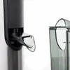 Close-up detail of a juicer's spout and a separate container, against a white background. Podgląd zdjęcia produktu