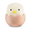 A cute chick in an eggshell. Produktbild-Vorschau