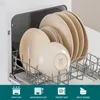 A dishwasher rack filled with beige plates and bowls. Náhled obrázku produktu