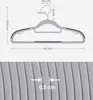 Diagram showing the dimensions of a gray plastic clothes hanger with anti-slip features. Náhled obrázku produktu