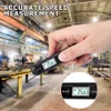 A hand holding a digital thermometer in a factory setting. Produktbild-Vorschau