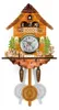 A decorative wooden cuckoo clock with figures and a pendulum. Náhľad obrázku produktu