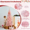 A child decorating a pink Christmas tree with gifts underneath, next to a fireplace. Produktbild-Vorschau