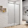 A modern bathroom with a sliding glass shower door. Produktbild-Vorschau