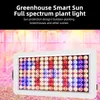 A full spectrum plant light is shown in front of a greenhouse. Náhled obrázku produktu