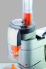 A close-up of a food processor attachment slicing carrots. Voir les images du produit