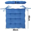 A blue seat cushion with tie straps is shown from a top-down view, with a side profile showing its thickness. Produktbild-Vorschau