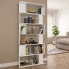 A white bookshelf filled with decorative items and books, placed in a living room setting next to a sofa and a plant. Náhľad obrázku produktu