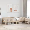 A wooden bed frame with bedding in a room with artwork on the wall and curtains. Voir les images du produit