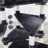 A close-up view of a multi-level cat tree with scratching posts and hanging toys. Produktbild-Vorschau
