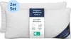 Two white pillows are shown, one slightly in front of the other, with a product label attached to the front pillow. Produktbild-Vorschau