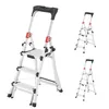 A product shot of a silver, black, and red aluminum stepladder, with two smaller versions of the same ladder shown in the background. Náhľad obrázku produktu