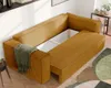 A mustard yellow corduroy sectional sofa with a hidden storage compartment in the middle, shown in a modern living room setting. Náhled obrázku produktu