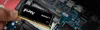 A hand is holding a RAM module over a computer motherboard. Anteprima dell’immagine prodotto