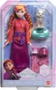 A doll and a fox toy in their packaging, with a winter forest scene in the background. Produktbild-Vorschau