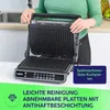 A person is demonstrating how to open a grill. Produktbild-Vorschau