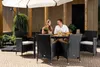 A couple is enjoying a meal at a table on a patio, under an umbrella. Náhľad obrázku produktu