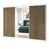 A sliding door wardrobe with wooden slats and a mirror, reflecting a bedroom interior. Produktbild-Vorschau