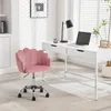 A pink velvet office chair is shown in a well-lit room with a white desk and a laptop. Produktbild-Vorschau