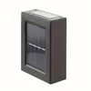 A solar-powered outdoor light fixture with a dark frame and a solar panel on top and front. Náhľad obrázku produktu