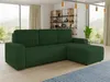 A green sectional sofa is shown in a modern living room with large windows and a bookshelf in the background.