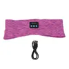 A pink and purple heathered headband with a small black control module, and a black USB charging cable below it, all on a white background. Náhled obrázku produktu