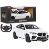 A white Rastar BMW X6 M RC car and its packaging are displayed, along with a remote control. Podgląd zdjęcia produktu