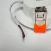 Close-up of a white LED downlight with a spring clip and wires. Anteprima dell’immagine prodotto