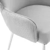 Close-up of a silver-gray upholstered chair with pleated detailing on the armrest and white metal legs. Podgląd zdjęcia produktu