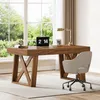 A home office desk with a laptop, lamp, and chair, set against a large window with greenery outside. Anteprima dell’immagine prodotto