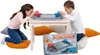 Two children playing a board game on the floor around a low table. Anteprima dell’immagine prodotto