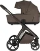 A brown stroller is shown against a white background. Náhled obrázku produktu