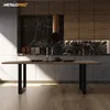 A modern kitchen with a dining table in the foreground. Podgląd zdjęcia produktu