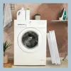 A laundry room scene with a washing machine, laundry detergent, a plant, and an ironing board with an iron. Produktbild-Vorschau
