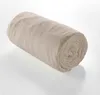 A rolled-up beige muslin fitted sheet on a white background. Náhled obrázku produktu