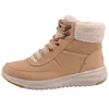 A side view of a single brown Skechers boot. Voir les images du produit