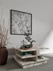 A modern living room scene featuring a marble coffee table with decorative items. Náhľad obrázku produktu