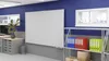 An office or classroom setting with a whiteboard, filing cabinets, and shelves with binders. Náhled obrázku produktu