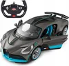A remote-controlled Bugatti Divo toy car with its steering wheel remote control. Produktbild-Vorschau