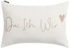 A rectangular pillow with text and a heart graphic. Produktbild-Vorschau