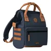 A navy blue backpack with tan accents is shown against a white background. Produktbild-Vorschau