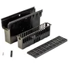 A black drainage system kit is laid out on a white background. The kit includes a channel, a basket, and a grate. Anteprima dell’immagine prodotto