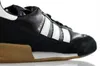 A close-up side view of a black and white Adidas sneaker with a gum sole. Anteprima dell’immagine prodotto