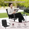 A woman is sitting in a black garden chair outdoors, reading a magazine. The scene includes greenery and a small table. Produktbild-Vorschau